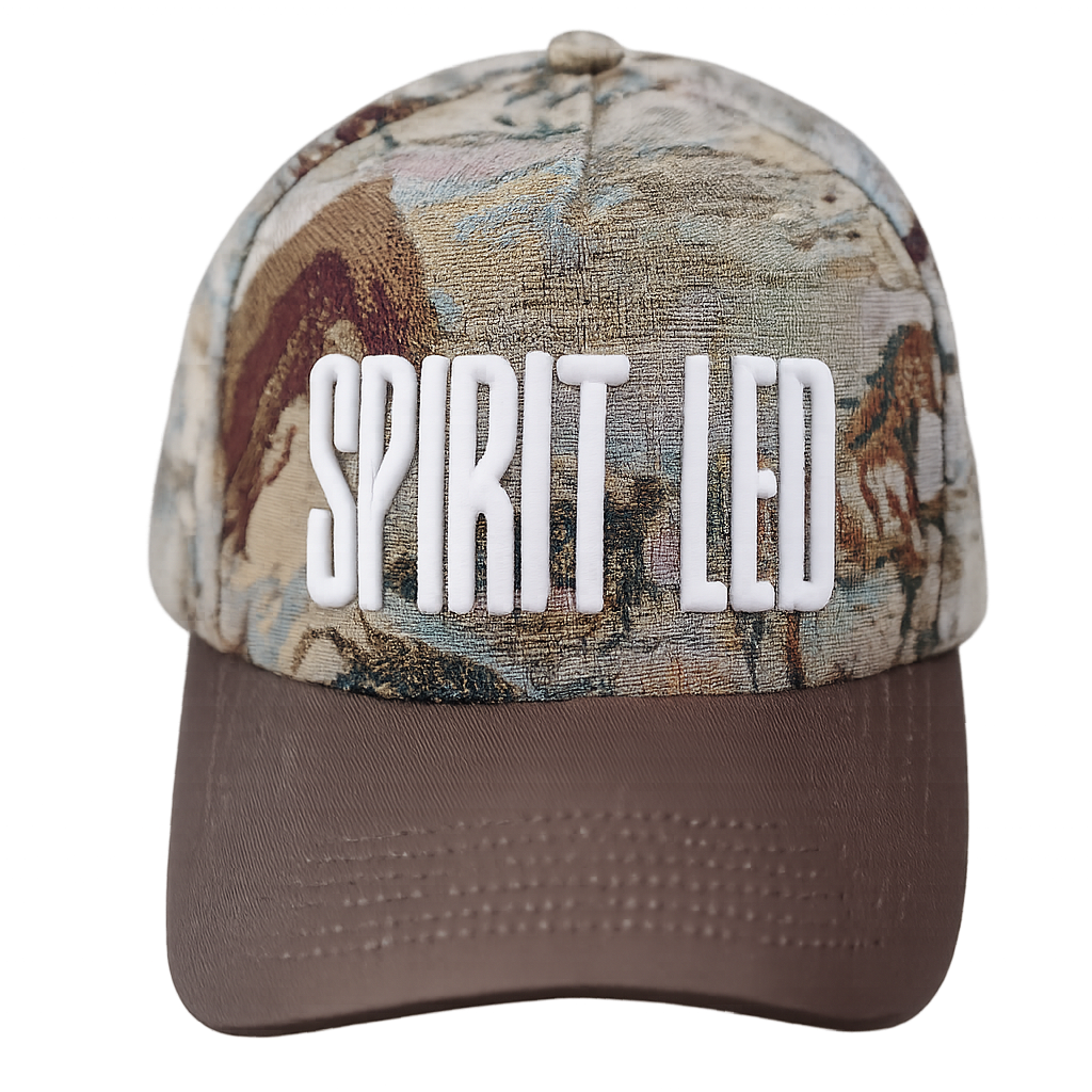 Camouflage cap with 'SPIRIT LED' text on a white background